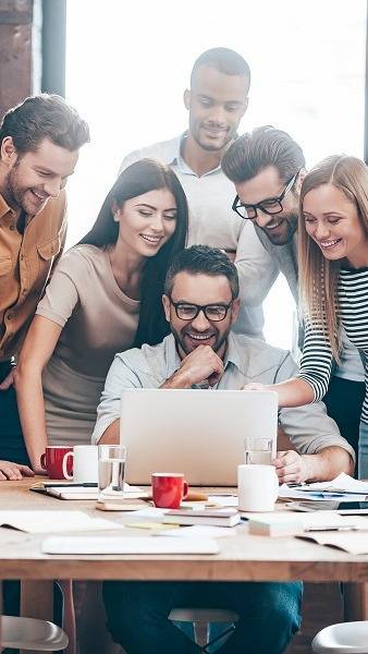 people smiling at computer